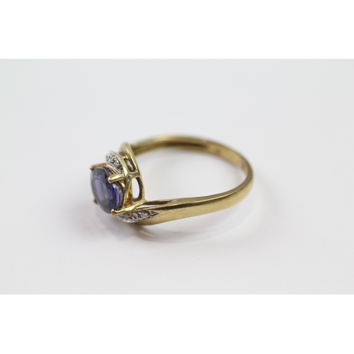 184 - 9ct gold diamond & iolite twist ring (2.8g) Size  Q 1/2