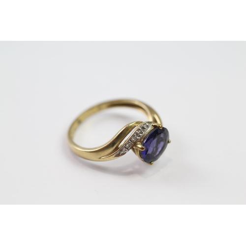 184 - 9ct gold diamond & iolite twist ring (2.8g) Size  Q 1/2