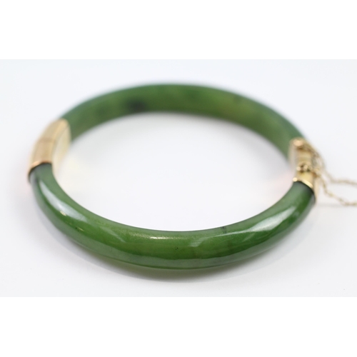 188 - 9ct gold nephrite bangle (26.6g)