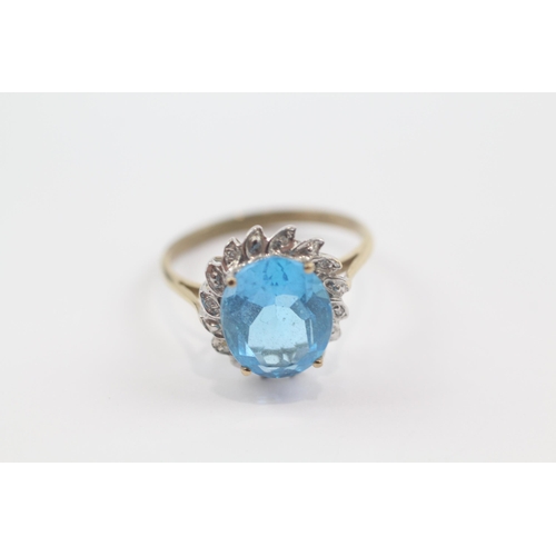 72 - 9ct gold blue topaz single stone ring with diamond frame (3.2g) Size  Q