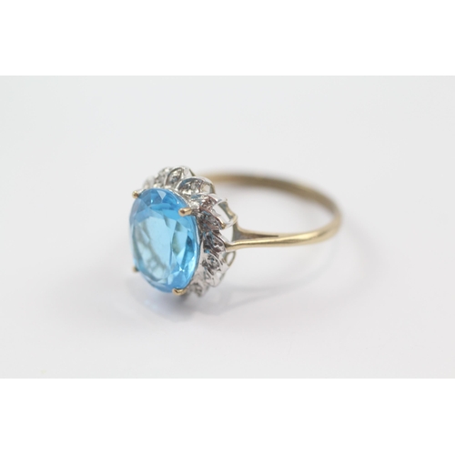 72 - 9ct gold blue topaz single stone ring with diamond frame (3.2g) Size  Q