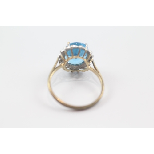 72 - 9ct gold blue topaz single stone ring with diamond frame (3.2g) Size  Q