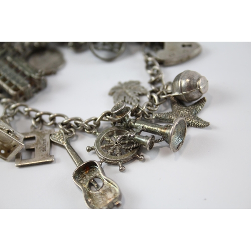 200 - Two silver charm bracelets including opening charms (108g)