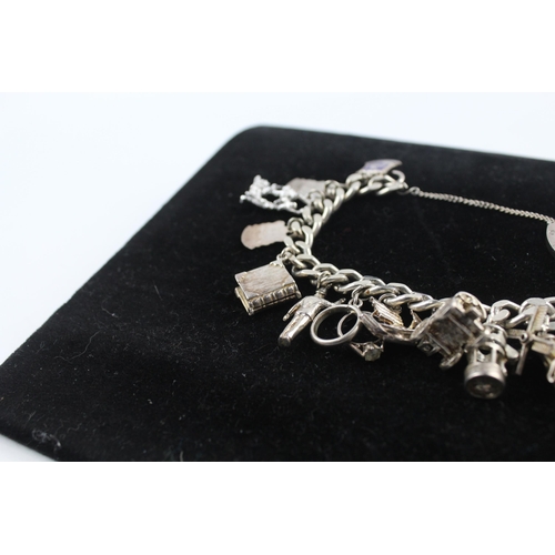 215 - Silver charm bracelet including souvenir charms (68g)