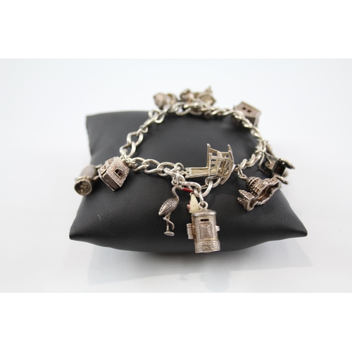 216 - Silver charm bracelet including clown charm (61g)