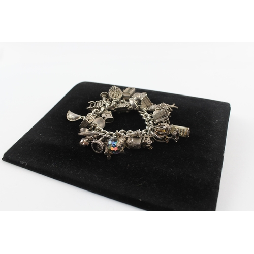 217 - Silver charm bracelet including opening charms (150g)