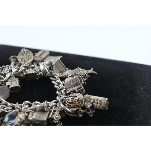 217 - Silver charm bracelet including opening charms (150g)