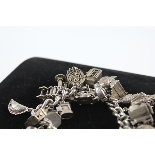 217 - Silver charm bracelet including opening charms (150g)