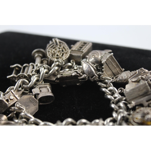 217 - Silver charm bracelet including opening charms (150g)