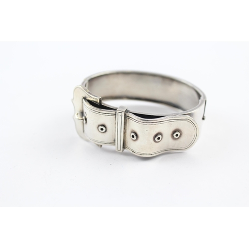 219 - Silver antique bangle with buckle design (34g)