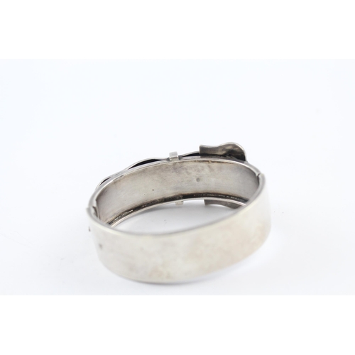 219 - Silver antique bangle with buckle design (34g)