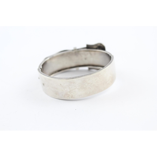 219 - Silver antique bangle with buckle design (34g)