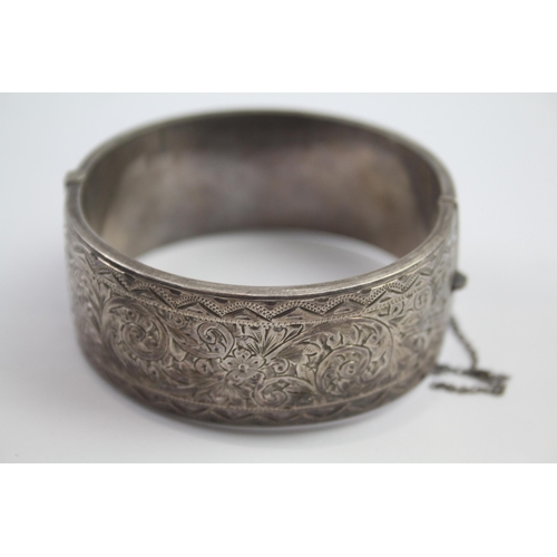 222 - Silver bangle with etched scrolling foliate design