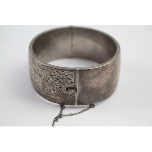 222 - Silver bangle with etched scrolling foliate design