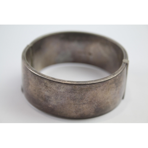 222 - Silver bangle with etched scrolling foliate design