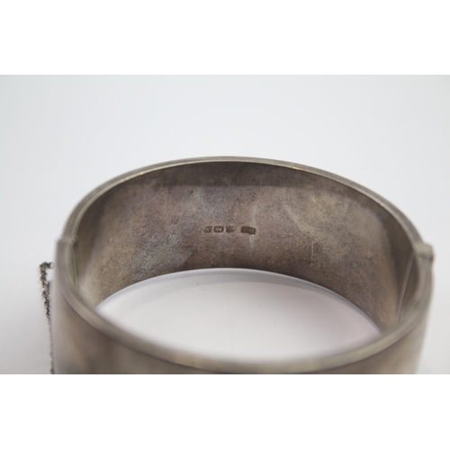 222 - Silver bangle with etched scrolling foliate design