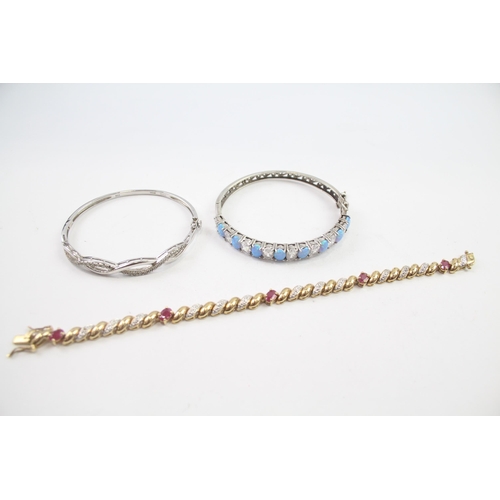 226 - Three silver gemstone bracelets/bangles including Ruby