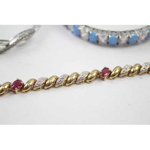 226 - Three silver gemstone bracelets/bangles including Ruby