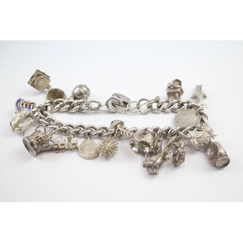 231 - Silver charm bracelet including opening charms