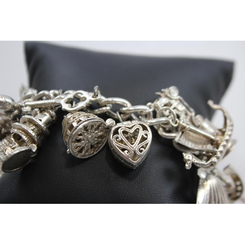 347 - A Vintage Silver Charm Bracelet With Assorted Novelty Charms (96g)