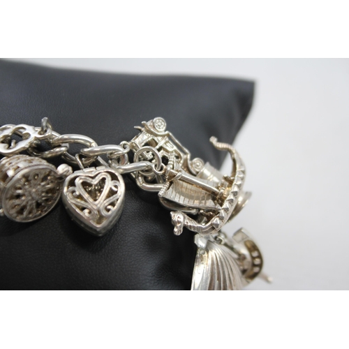 347 - A Vintage Silver Charm Bracelet With Assorted Novelty Charms (96g)