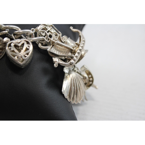 347 - A Vintage Silver Charm Bracelet With Assorted Novelty Charms (96g)