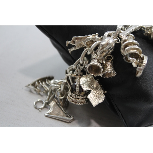 347 - A Vintage Silver Charm Bracelet With Assorted Novelty Charms (96g)