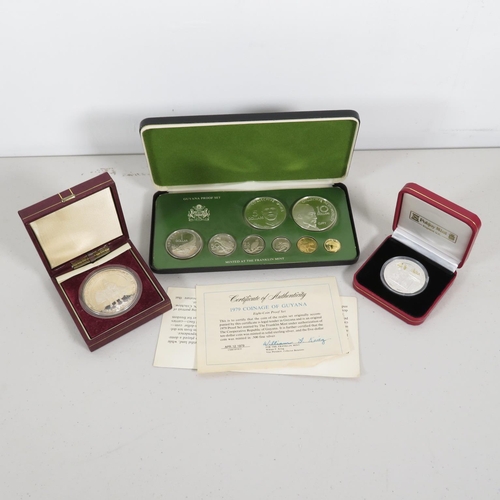 409 - 3x coin packs 1x containing Pobjoy Mint silver coin along with a Royal Marines silver coin weighing ... 