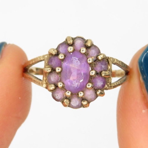 131 - 9ct gold amethyst vintage cluster ring (2g).  Ring has been cut off Size  M