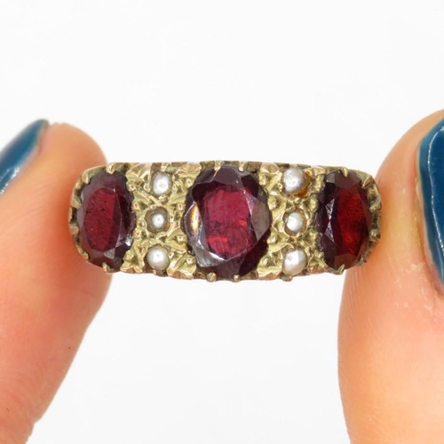 163 - 9ct gold garnet & seed pearl vintage ring (5.4g). Ring has been cut off Size  P