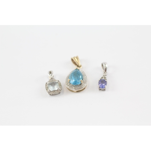 105 - 3 x 9ct white & yellow gold gemstone pendants inc. diamond, aquamarine, tanzanite & blue topaz (2.9g... 