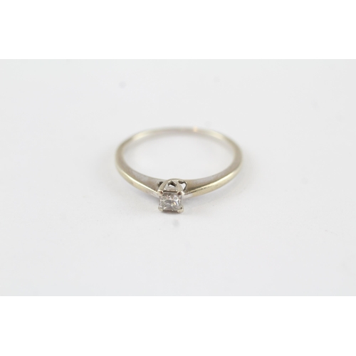 130 - 9ct gold diamond solitaire ring (1.6g) Size  M