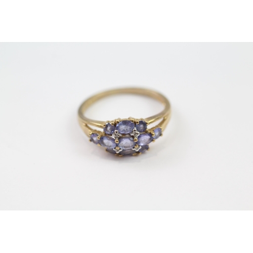 139 - 9ct gold tanzanite & diamond cluster ring (2.5g) Size  P