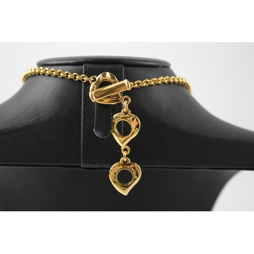 183 - Gold tone heart necklace by designer YSL with pouch