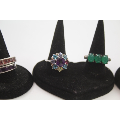 186 - A collection of silver gemstone rings including Amethyst