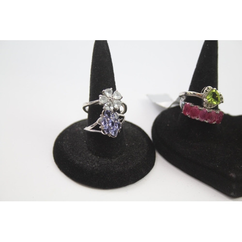 188 - A collection of silver gemstone rings including Ruby