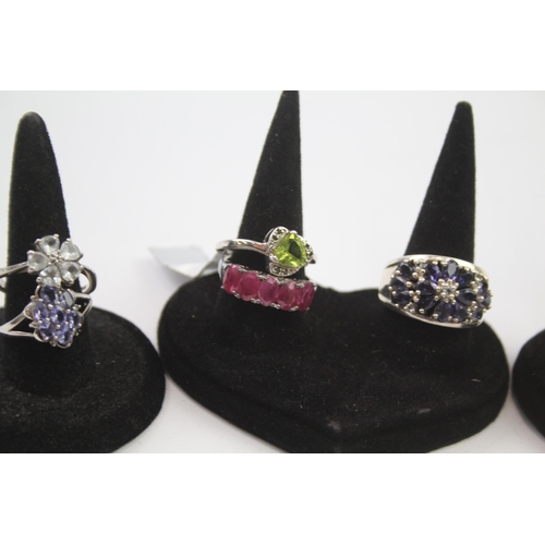 188 - A collection of silver gemstone rings including Ruby