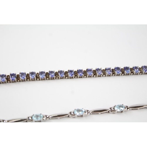 189 - Four silver gemstone tennis bracelets including CZ