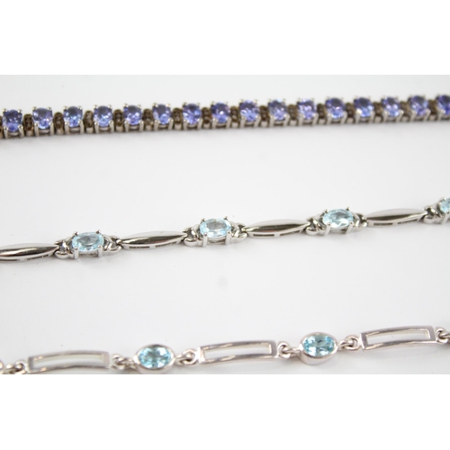 189 - Four silver gemstone tennis bracelets including CZ