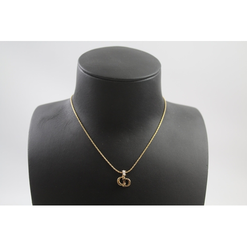 207 - Gold tone necklace with logo pendant by designer Christian Dior