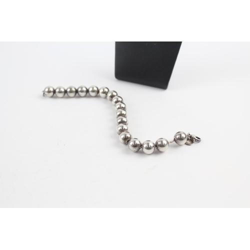 210 - Silver bracelet and earrings set by designer Tiffany & Co