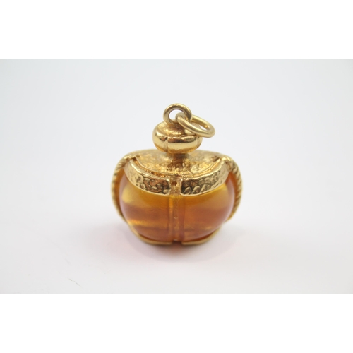 215 - Gold tone perfume bottle design pendant by designer YSL