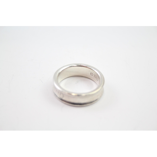 217 - Silver band ring by designer Tiffany & Co.  Size R 1/2