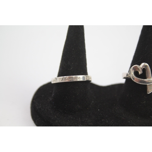 223 - Two silver love rings by designer Tiffany & Co.  Size N