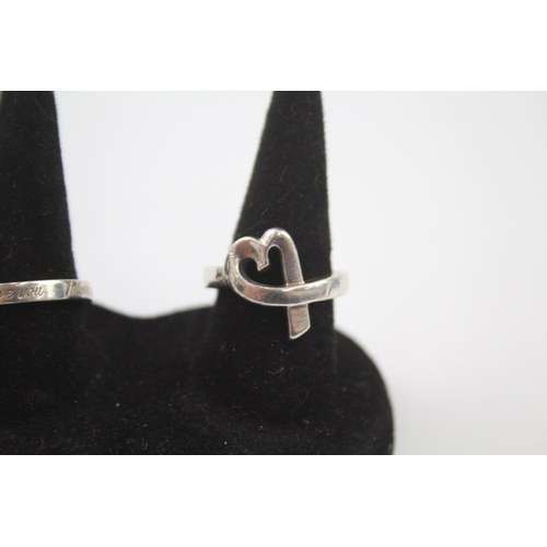 223 - Two silver love rings by designer Tiffany & Co.  Size N