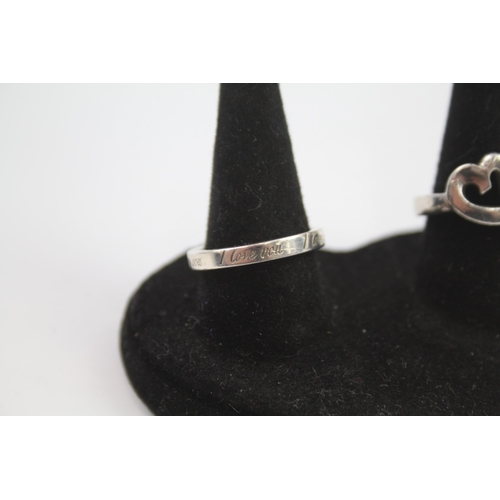 223 - Two silver love rings by designer Tiffany & Co.  Size N