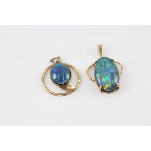 74 - 2 x 9ct gold black opal triplet pendants (2.7g)