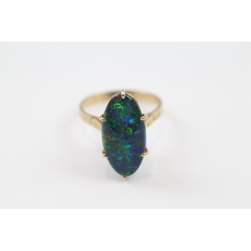 77 - 9ct gold black opal triplet singe stone cocktail ring (3.5g) Size  Q 1/2