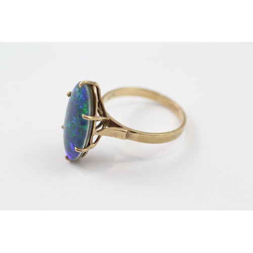 77 - 9ct gold black opal triplet singe stone cocktail ring (3.5g) Size  Q 1/2