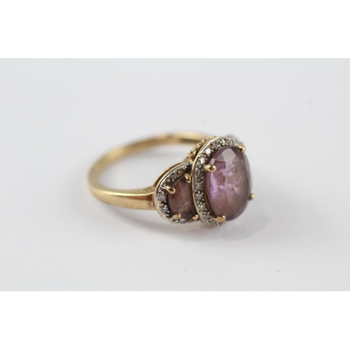 96 - 9ct gold amethyst three stone ring with diamond frame (3.3g) Size  N